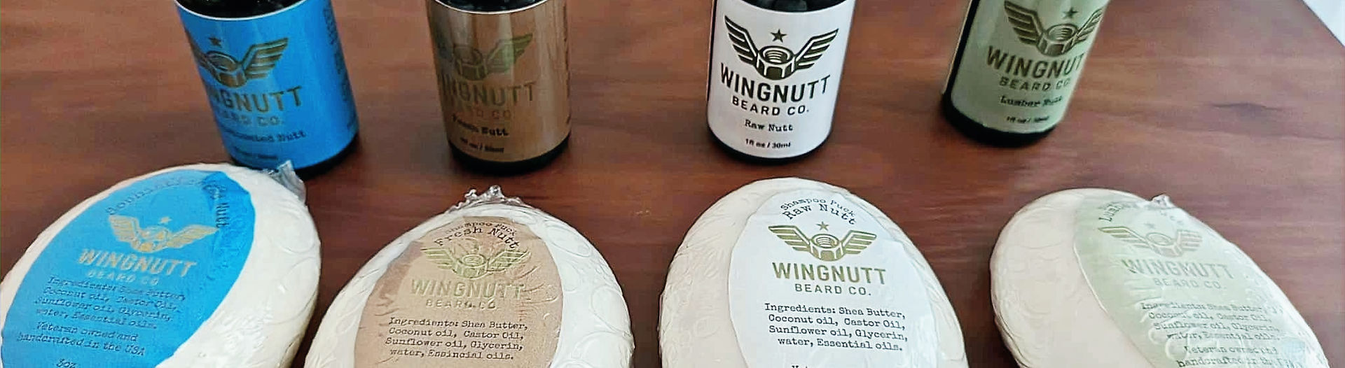 Wingnutt Beard Co. handcrafted beard oils lined on timber grain
